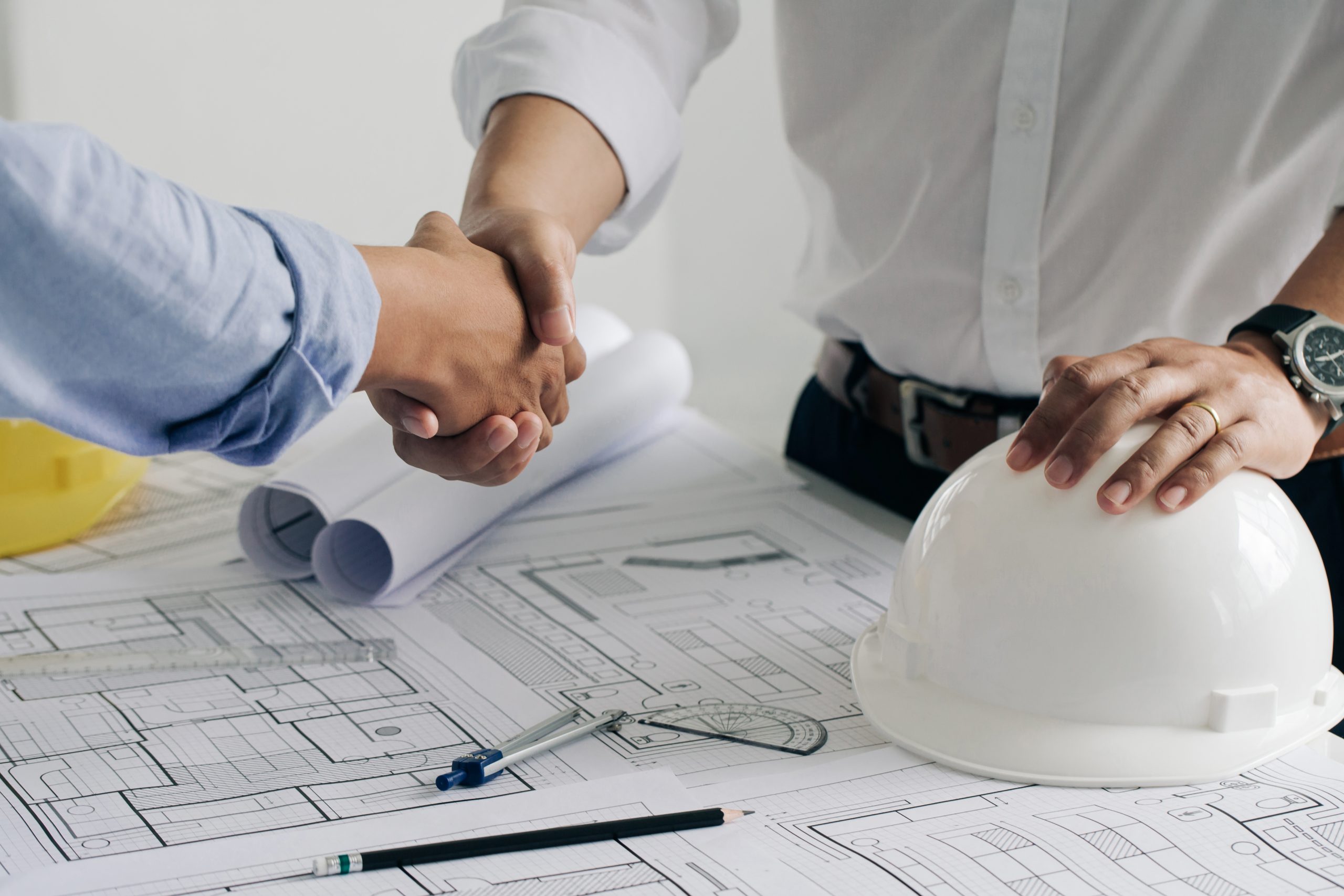 Shaking hands collaboration construction engineering architect