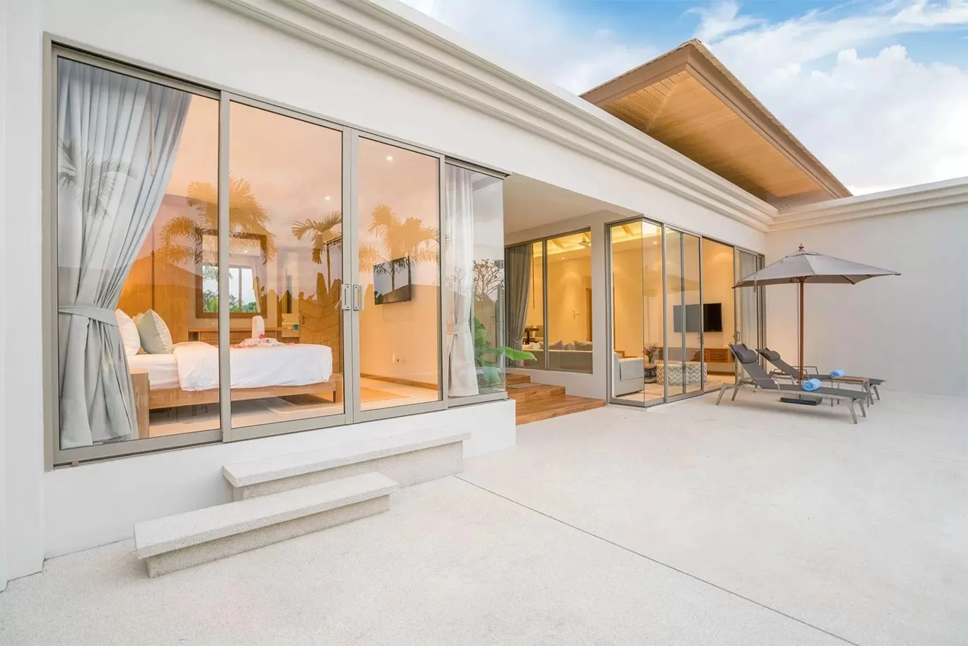 Luxury Villa with Sliding Glass Doors and Outdoor Seating
